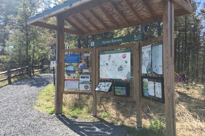 wooden pavilion with signage for recreation trail users